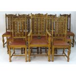 A set of twelve 19thC oak dining chairs with carved top rails, turned support and carved backrests,