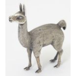 A white metal model of a Lama / Alpaca 2 1/2" high overall.