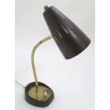 A 20thC Pifco model 971 desk lamp, the base and shade with bronzed finish, with adjustable arm.