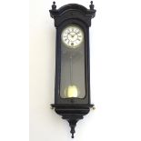 A late 19thC miniature regulator wall clock, ebonised case with glazed door and side panels,