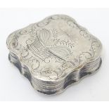 A Continental silver snuff box of squared shaped form with engraved decoration.