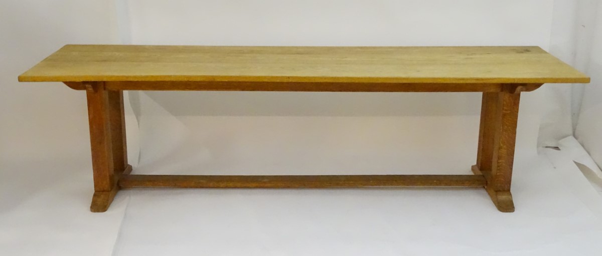 An early 20thC large Arts & Crafts style oak dining / refectory table with a rectangular top above - Image 2 of 9