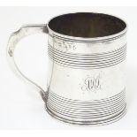 A 19thC silver Christening mug of tankard form with banded decoration. Hallmarked London c.