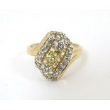 A 9ct gold dress ring set with a profusion of white and yellow stones. Ring size approx.