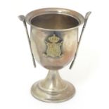 A Silver pedestal trophy cup with gold club decoration and having shield crest titled RFBG 3 1/2"