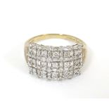 A 9ct gold dress ring set with a profusion of diamonds. Ring size approx.