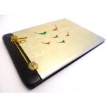 A Japanese lacquered wooden postcard / photograph album with hinged front cover decorated with