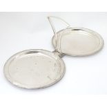 A silver plate folding cake stand by Hukin & Heath,