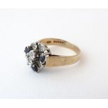 A 9ct gold ring set with sapphire and diamonds. Ring size approx.