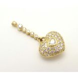 An 18ct gold pendant formed as a heart,