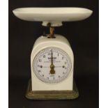 An early 20thC Salter improved family kitchen balance scale with an unusual ceramic pan,