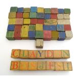 Toys: Early 20thC vintage painted wooden children's building blocks, some with letters and numbers.