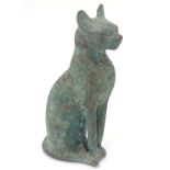 A cast bronze model of a seated cat. Approx.