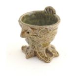 A novelty stoneware egg cup modelled in the style of a Martin Brothers' wally bird.