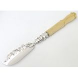 A Victorian silver butter knife with ivory handle. Hallmarked Sheffield 1875 maker AH.