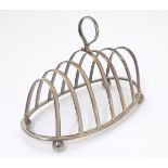 A silver 7-bar toast rack hallmarked Sheffield 1913 maker Joseph Rodgers & Sons Ltd.