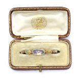 A Victorian yellow metal (tests as gold) brooch set with moonstone and opals.