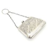 A silver purse with embossed and engraved decoration. Hallmarked Birmingham 1919 maker F D Long.
