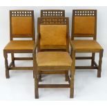 A set of four oak Arts and Crafts style dining chairs in tan leather made by Derek ‘Lizardman’