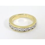 An 18ct gold half eternity ring set with 10 diamonds ( the diamonds approx .20ct) Ring size approx.