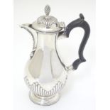 A Victorian silver coffee pot with ebonised handle. Hallmarked London 1875 maker Henry Holland.