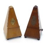 Two 20thC walnut cased clockwork metronomes by Maelzel, France.