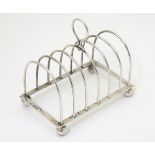 A silver 7-bar toast rack hallmarked Chester 191 maker George Nathan & Ridley Hayes.