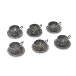 A Continental silver Dolls house miniature tea set comprising 6 cups and saucers .