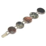 Scottish Agate jewellery: A white metal bracelet set with various agate oval specimens including