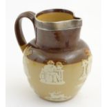 A Royal Doulton two tone salt glaze jug with hallmarked silver rim, Chester 1905,