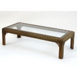 A 20thC Oriental style coffee table with a reeded frame and Chinese Chippendale style corner