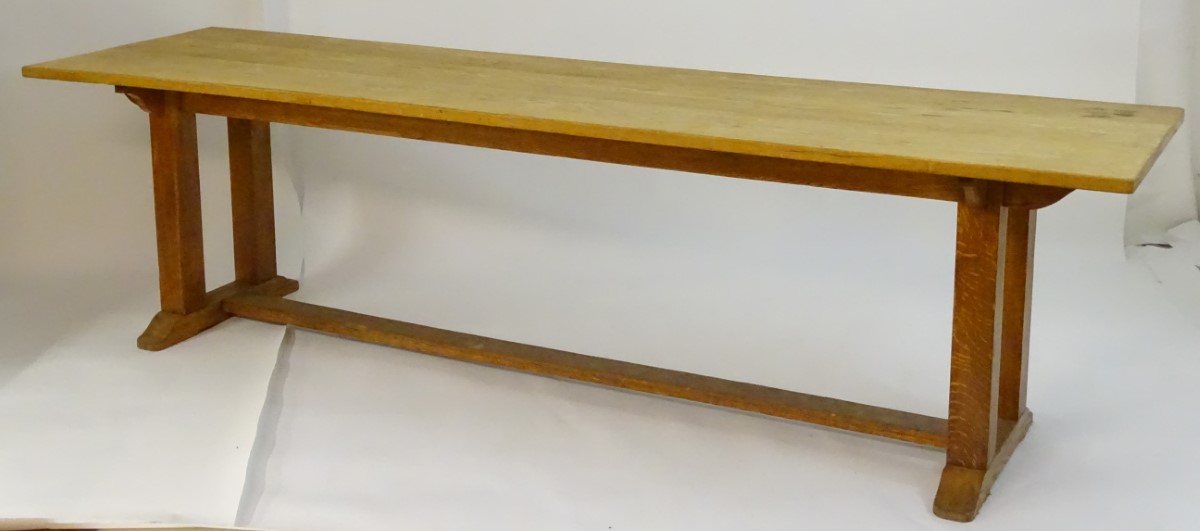 An early 20thC large Arts & Crafts style oak dining / refectory table with a rectangular top above - Image 5 of 9