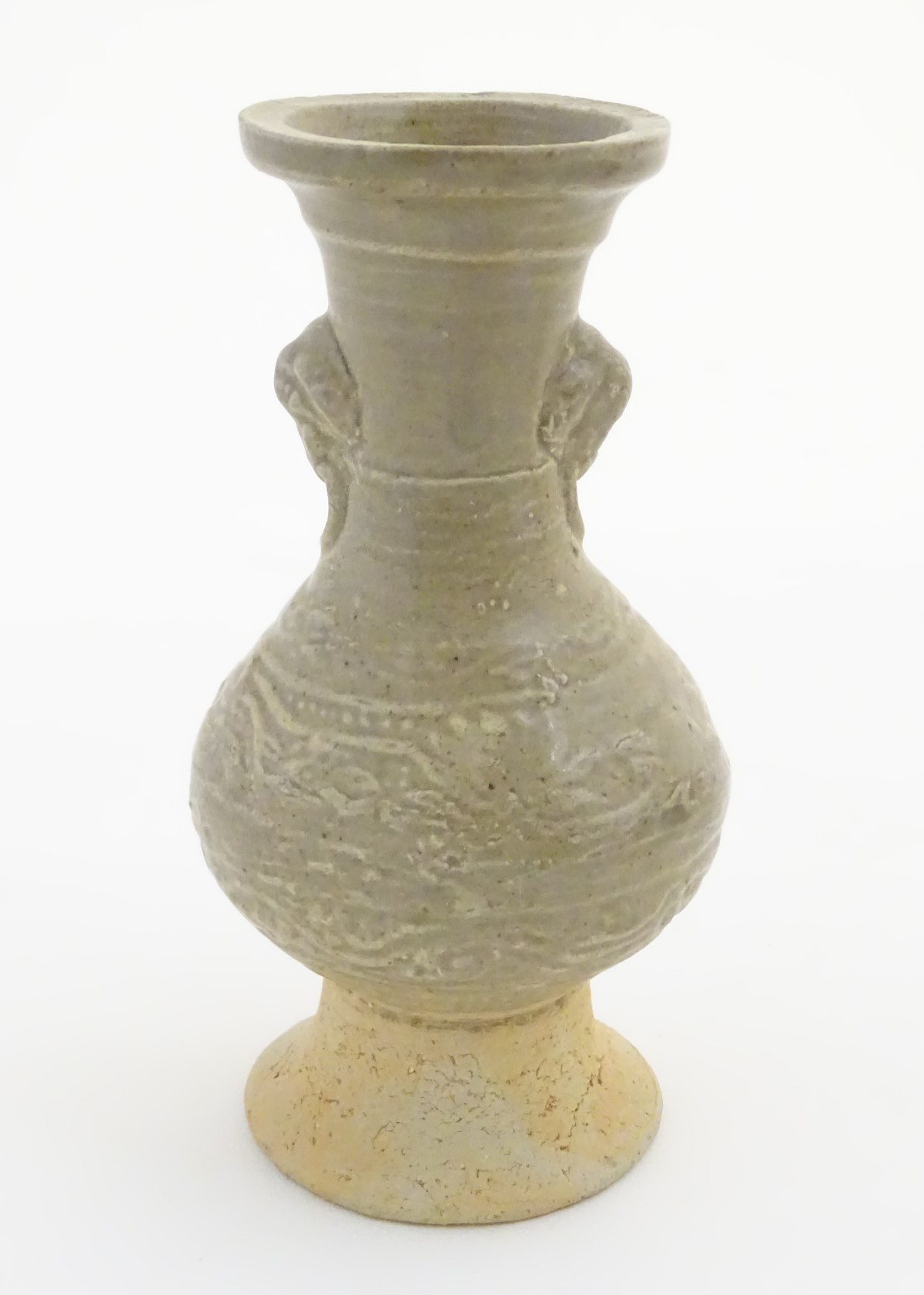 An Oriental earthenware vase with a flared base and rim, elephant head handles. - Image 5 of 6