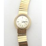 A ladies Omega 9ct gold cased wristwatch with 9ct gold strap.