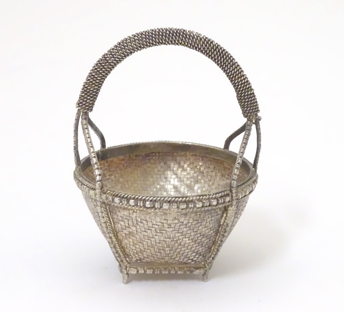 A white metal dish formed as a woven basket. - Image 3 of 5