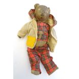 Toy: An early 20thC straw filled teddy bear, with a stitched mouth, nose and eyes. Approx.