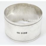 A silver napkin ring, hallmarked Sheffield 1911, maker Roberts & Belk.