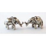 A pair of silver novelty pendant charms formed as elephants. Approx.