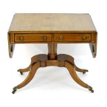 A Regency rosewood sofa table with a rectangular brass inlaid top above brass inlaid drawer fronts