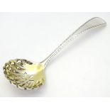 A silver sifter / caster spoon with gilded bowl hallmarked Birmingham 1913 maker barer Brothers