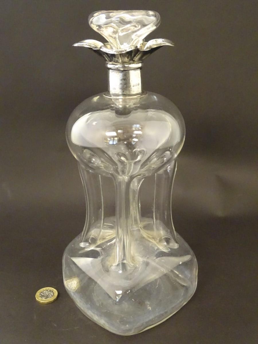 A glass decanter with pinch waist detail and silver rim hallmarked Birmingham 1906. 11" high - Image 3 of 8