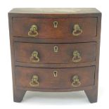 A Victorian apprentice piece formed as a bow fronted chest of drawers.