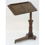 A late 19thC ‘Leveson & Sons’ mahogany reading stand / lectern with an adjustable top and writing