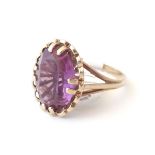 A 9ct gold ring set with oval amethyst, hallmarked Birmingham 1919, maker D & W. Ring size approx.