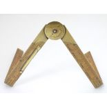 Vintage Tools: A boxwood and brass mounted surveyor's rule with an integrated spirit level and