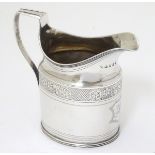 A Geo III silver jug with bright cut banded decoration. Hallmarked London 1800 maker SH.