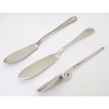 Two small silver butter knives together with a preserve spoon (3) CONDITION: Please