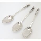 A set of 3 Victorian silver teaspoons with caryatid decoration to handles.