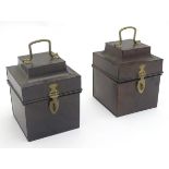 A pair of tin boxes / caddies, each with a hinged lid, handle and catch. Approx. 7 1/2" tall.