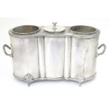A silver plate 2-bottle wine cooler with central cooling section 15" wide overall